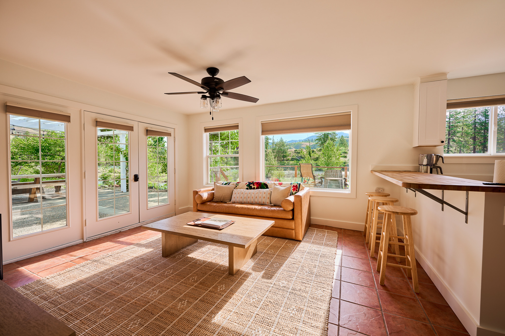 Guest suite living room, windows on two sides